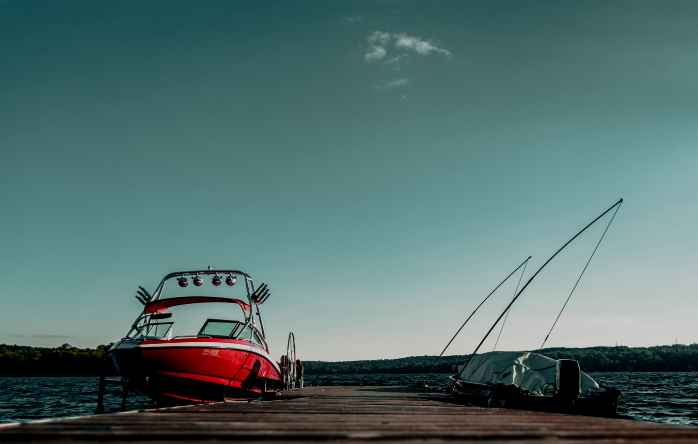 A red powerboat at the dock. 