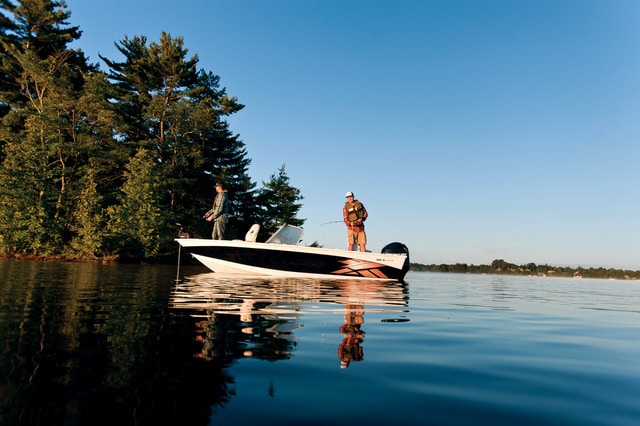 Two anglers on a fishing boat with line sin the water, follow Maryland boating regulations concept. 