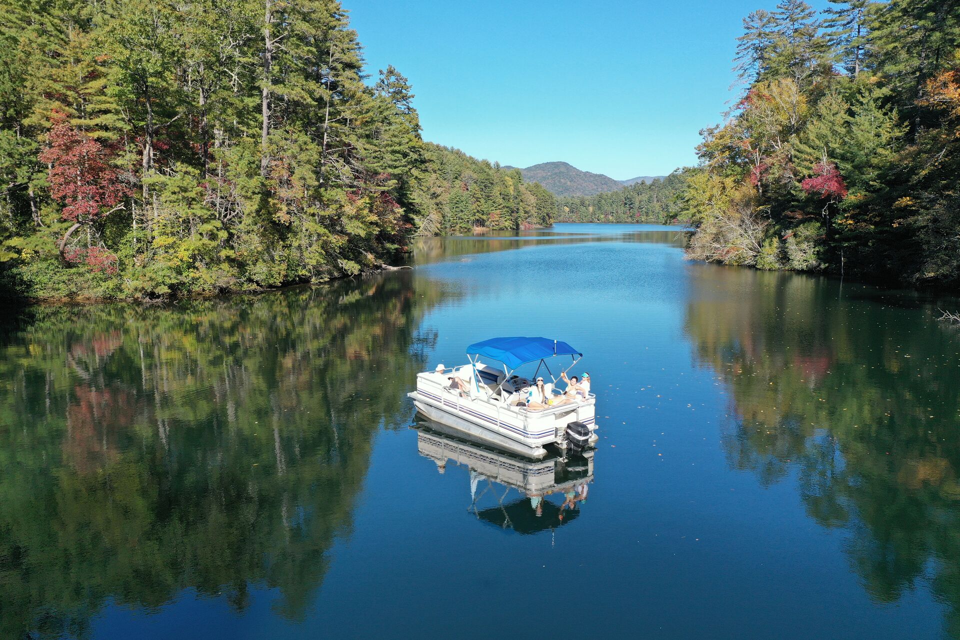 A pontoon boat on a lake, boating in British Columbia concept. 