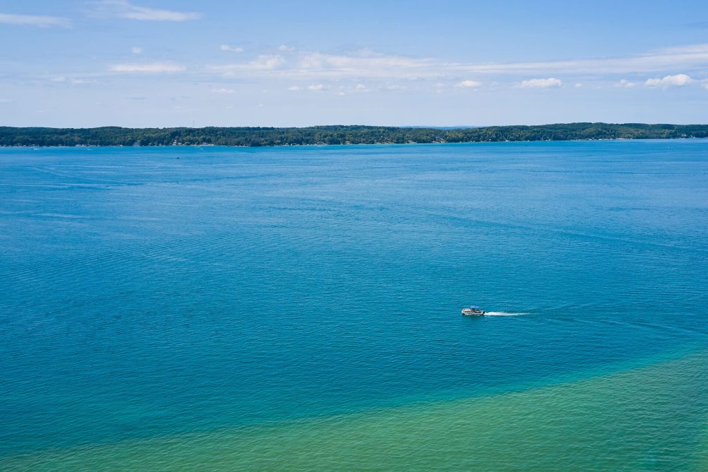 Overhead view of a lone boat on a big lake