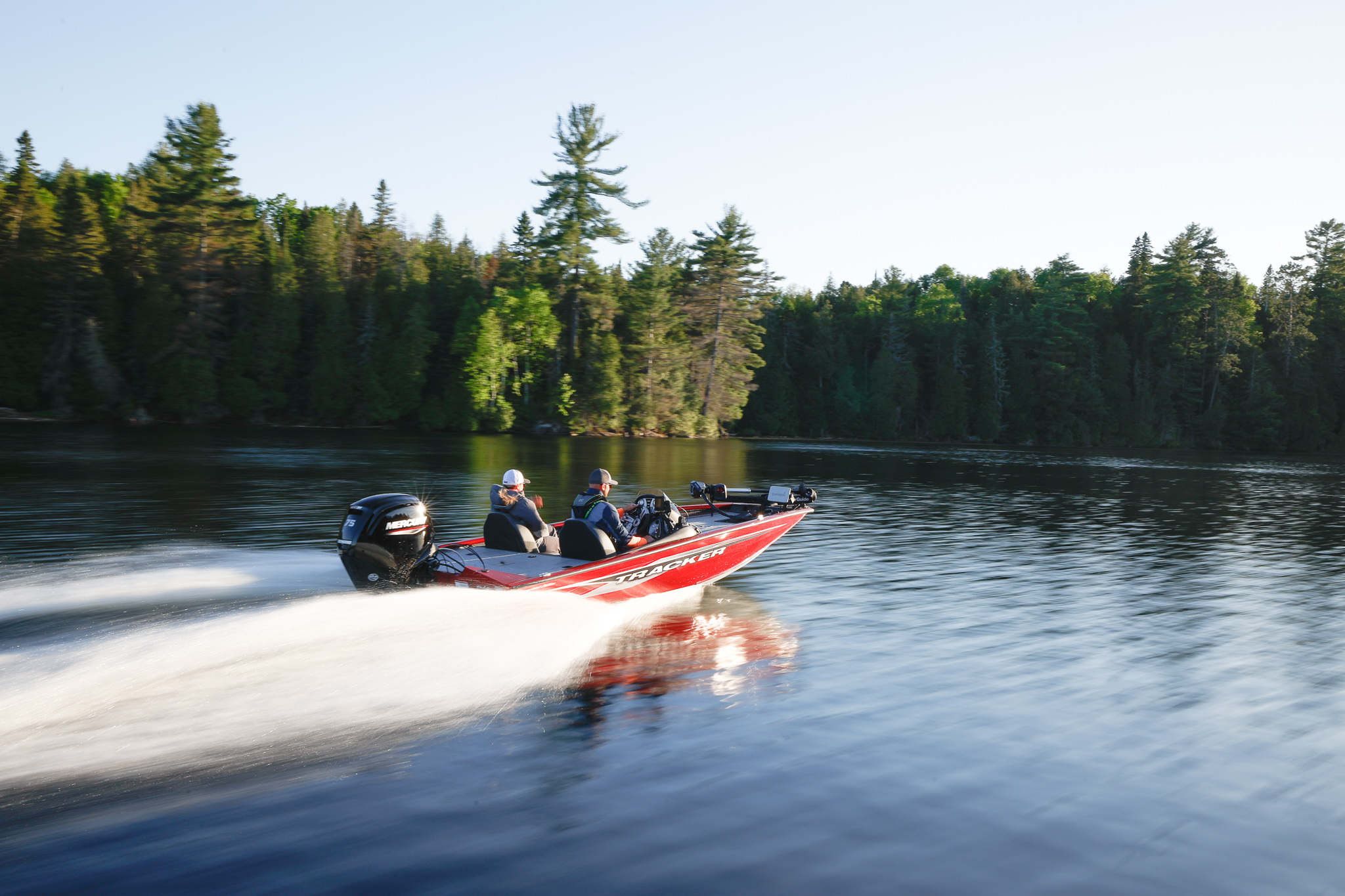 Two people on a fast fishing boat, fall fishing concept. 