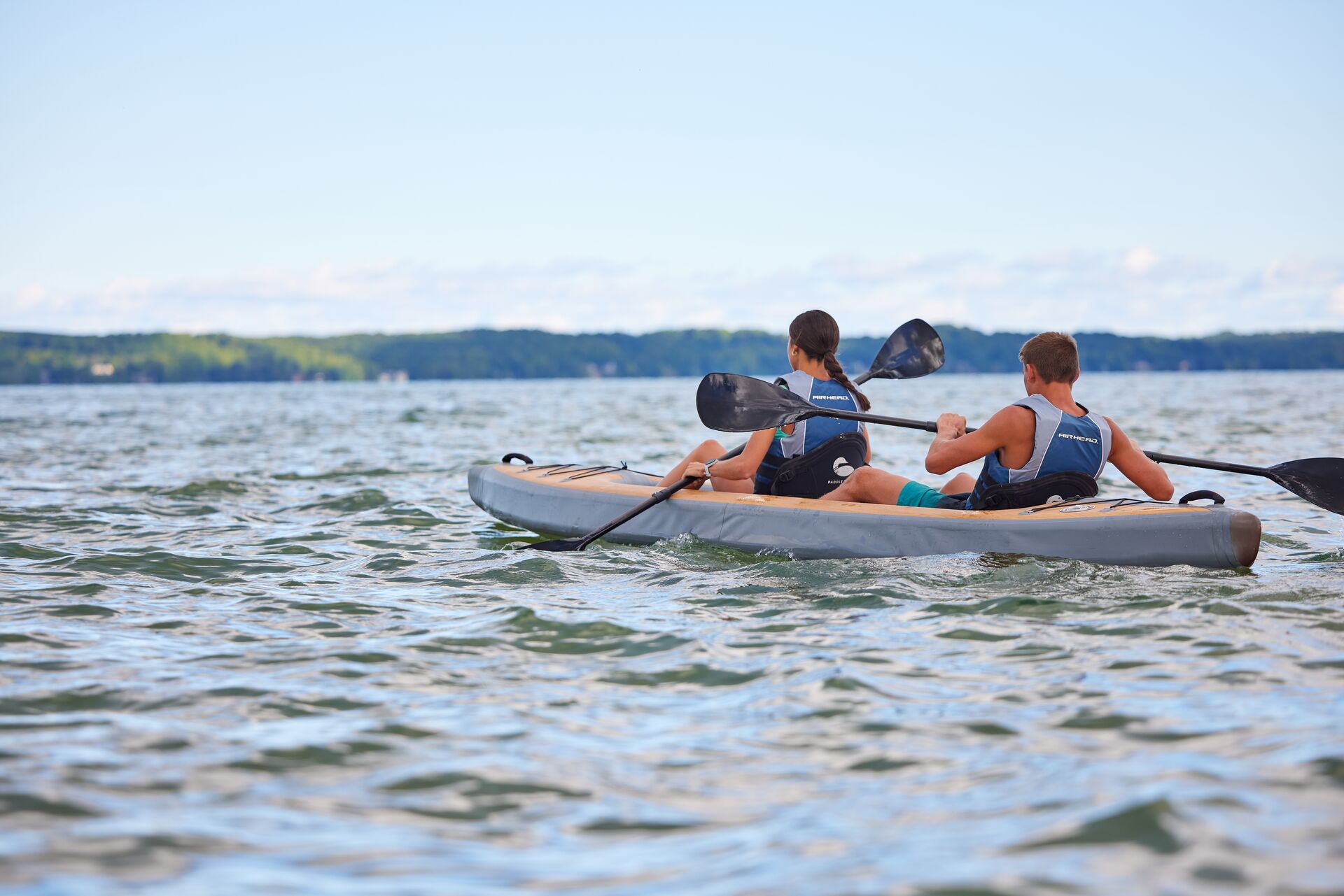 Two people on a kayak on the lake, Idaho boating concept. 