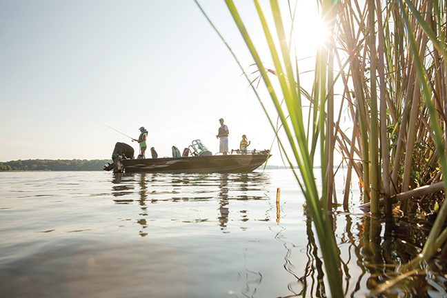 People on a fishing boat on a lake, boating in Pennsylvania concept. 