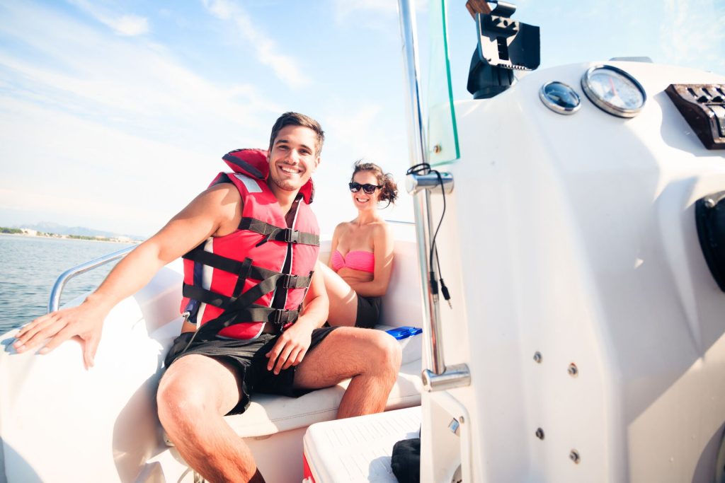 Smiling people on a boat.