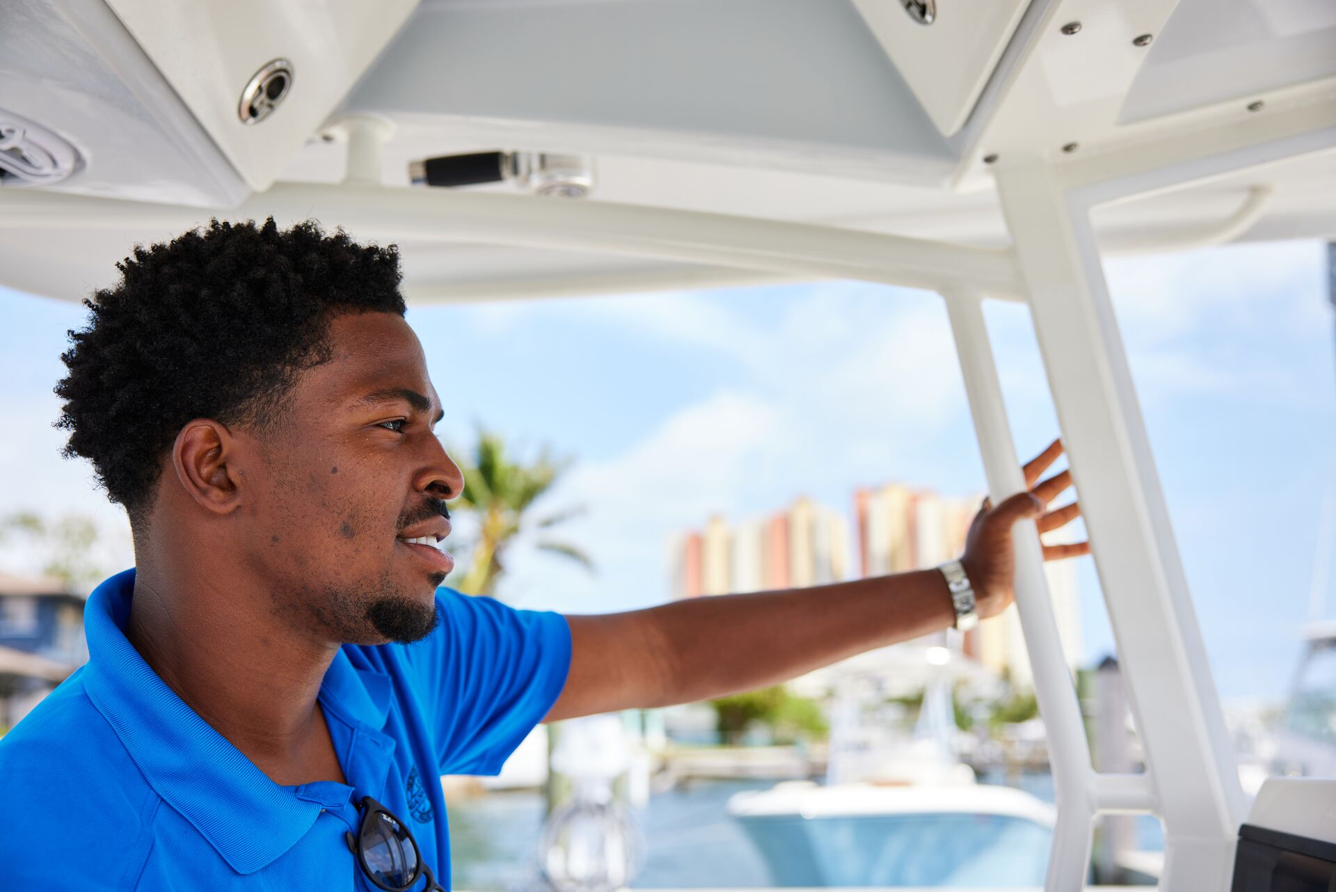 A man driving a boat, protecting the water from aquatic nuisance species concept. 