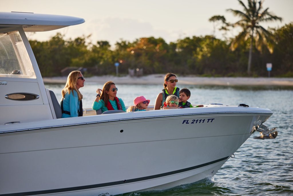 People wearing lifejackets on a boat, license to drive a boat in Florida concept. 