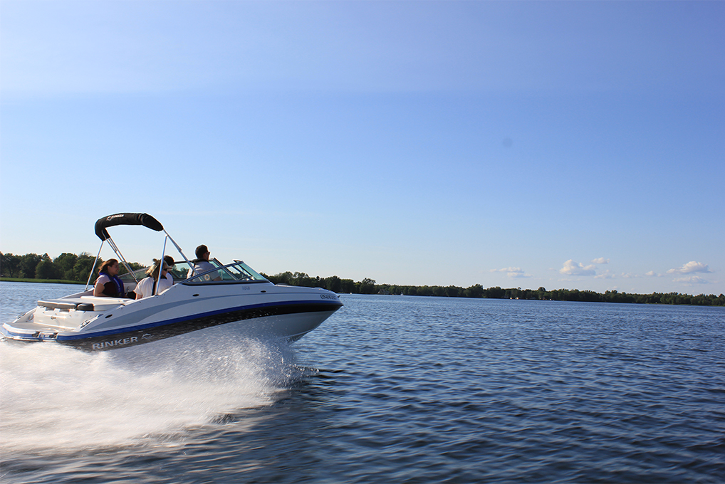 People enjoying a boat on the water.