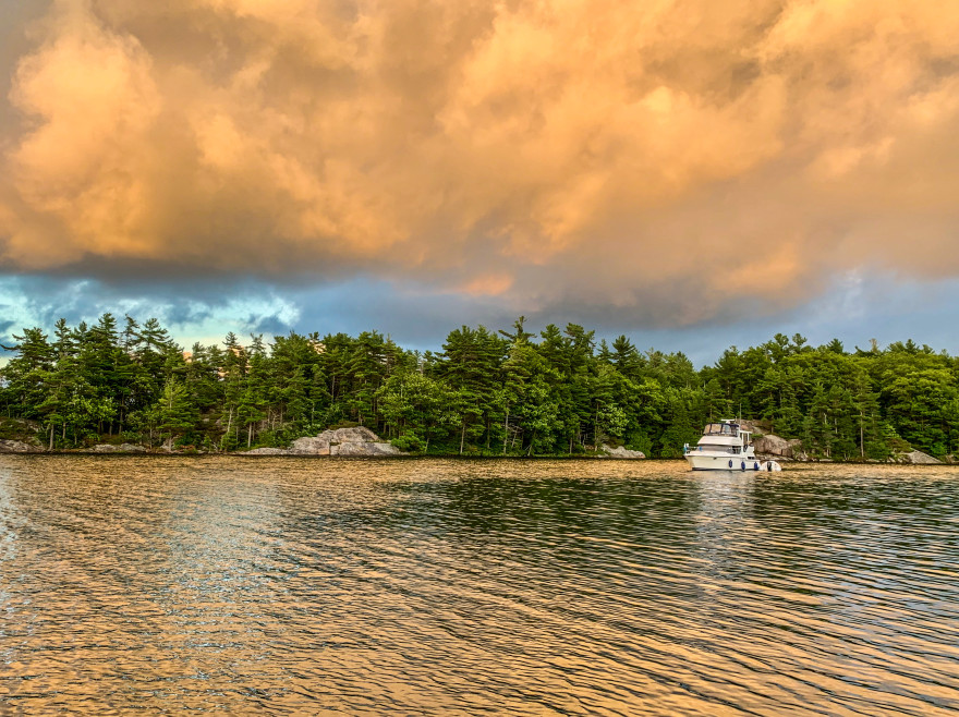 A boat anchored on the water, boating in Saskatchewan concept. 