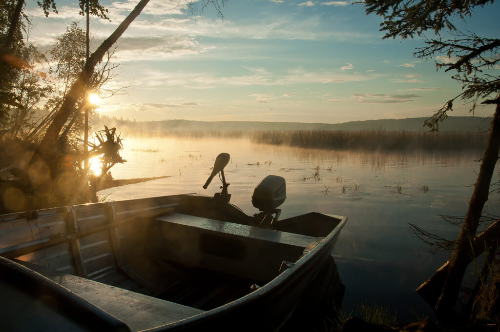 A small boat on the lake, how to register a boat in Manitoba concept. 