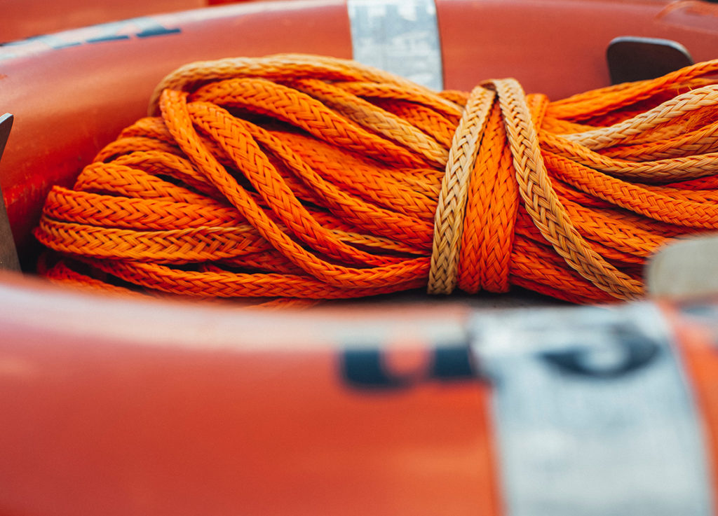 An orange rope on a boat.