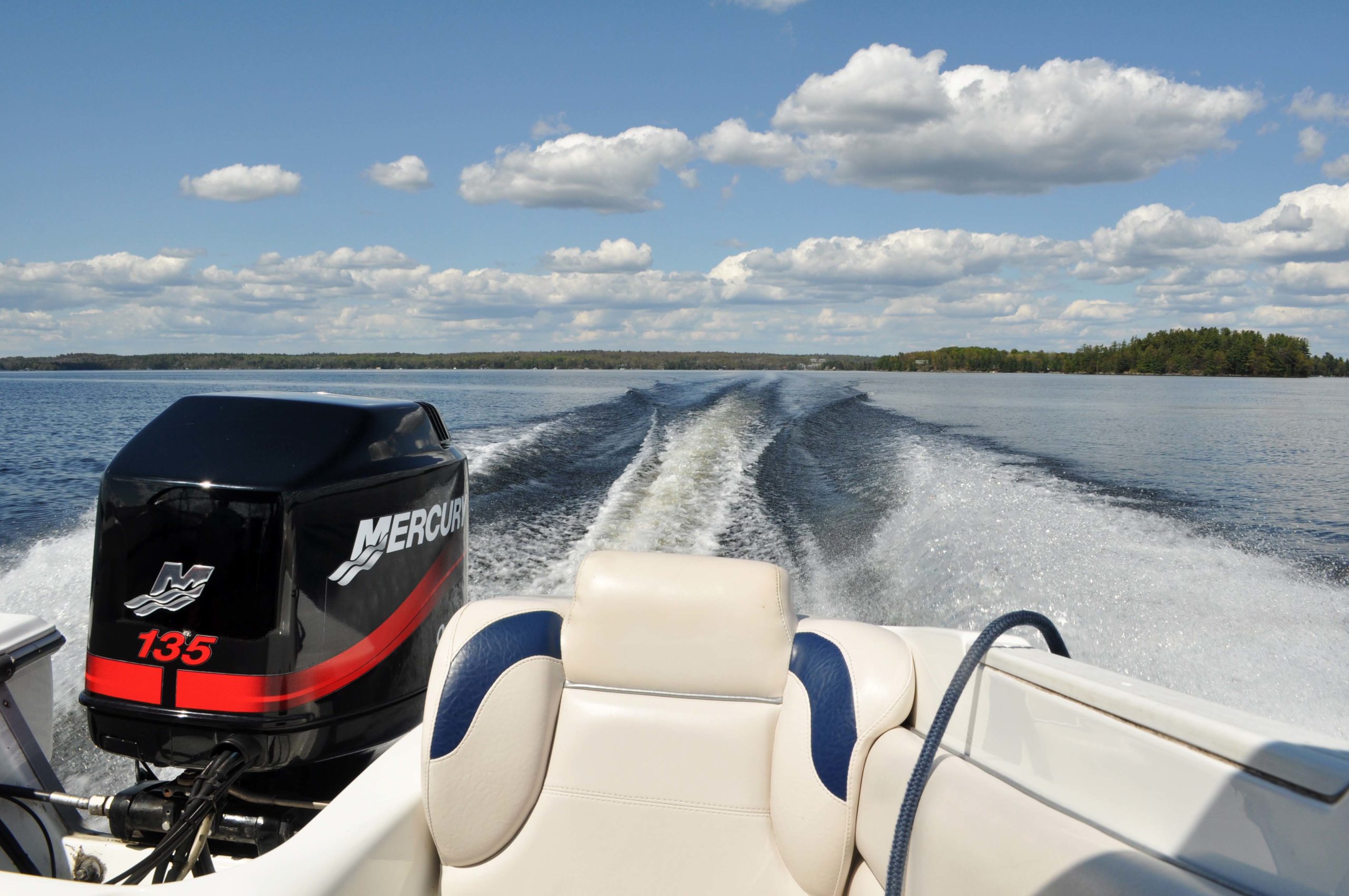 View from the back of a boat at the wake in the water.