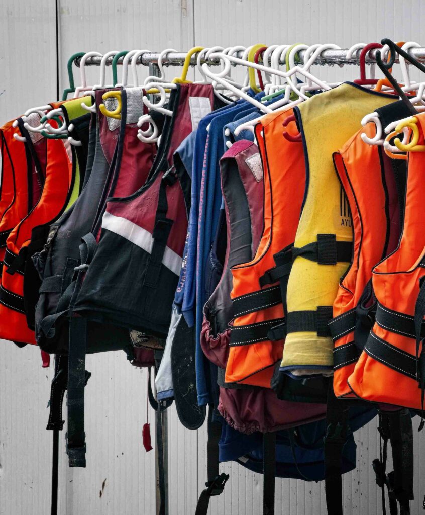 A rack full of life jackets, safety when ice fishing concept.