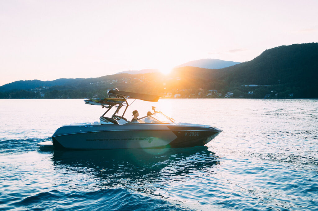 Two people on a boat on a lake, boat registration Ohio concept.