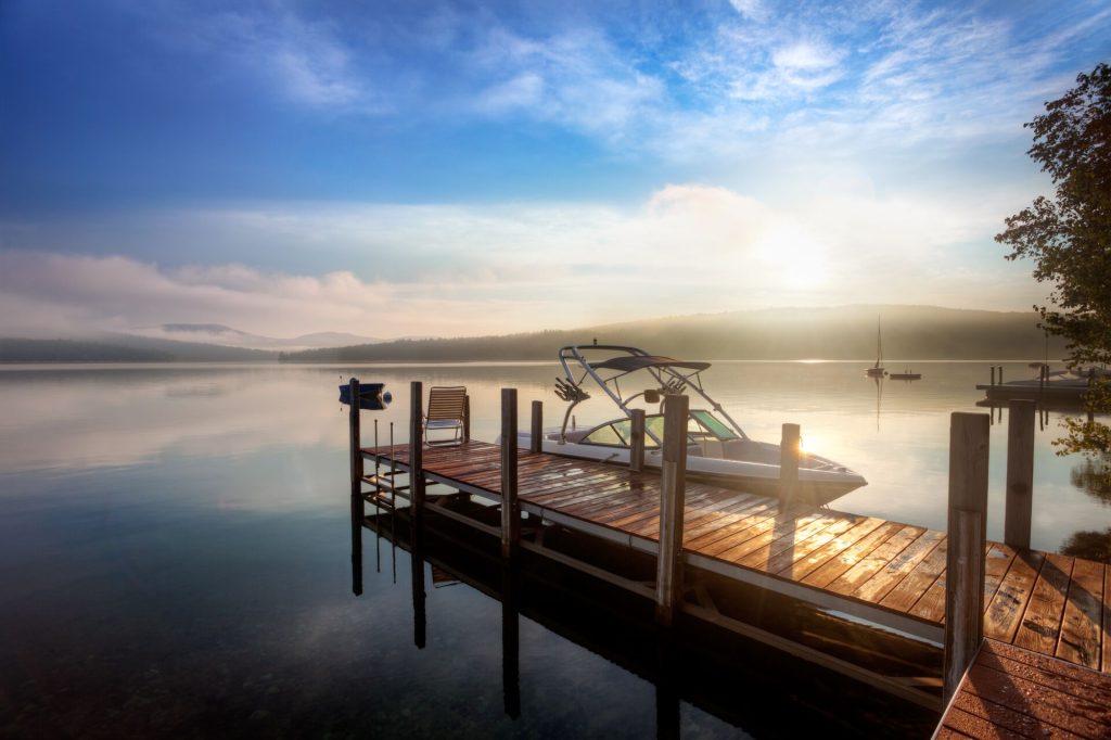 A boat at the dock on calm waters, avoid drinking and boating alcohol concept.