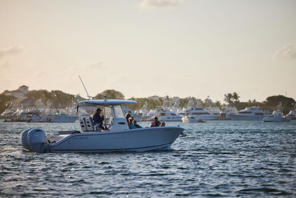 A boat with people on it on the water, safe boating concept.